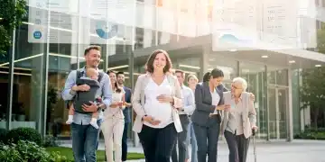 Diverse employees benefiting from updated family leave policies in a modern workplace setting
