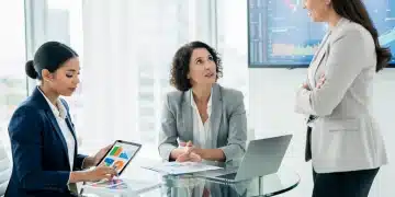 SEC Regulations 2026: What Women Investors Need to Know Women reviewing financial documents and discussing investment strategies in a modern office setting.